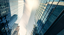 Upward perspective of multiple city skyscrapers